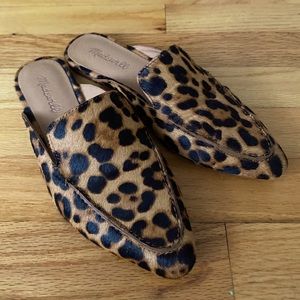 A chic mule with an animal print construction.